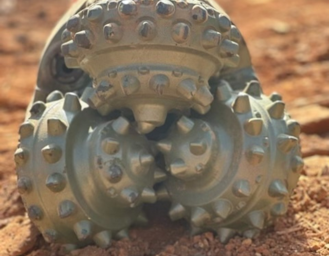 Tricone drill bit in dirt